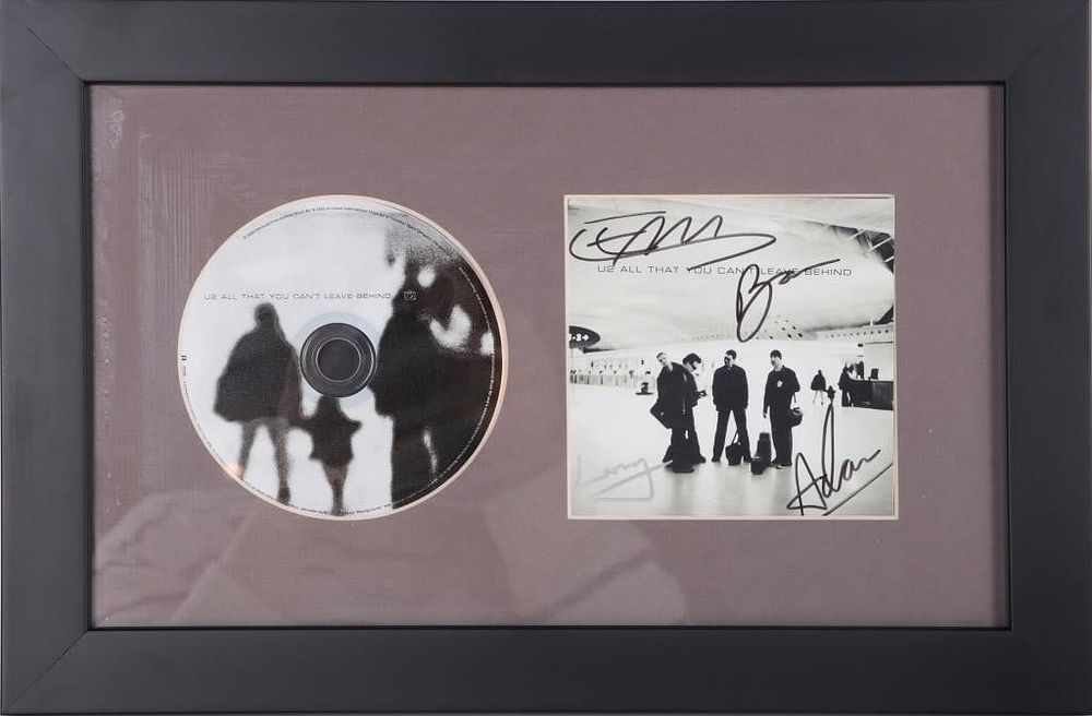 Lot 233434: U2 SIGNED CD ALL THAT YOU CANT LEAVE BEHIND FRAMED
