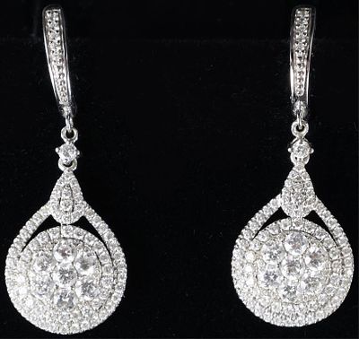 DIAMOND STUDDED 14K WHITE GOLD LADIES EARRINGS. Pair of 14k white gold ladies earrings, studded 