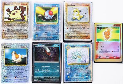 ASSORTED 2002-2023 COLLECTIBLE POKEMON CARDS - (7). Assorted 2002-2023 collectible Holo Pokemon 