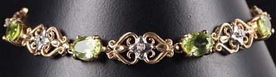 14K YELLOW GOLD PERIDOT DIAMOND LADIES BRACELET. 14K yellow gold peridot diamond ladies 