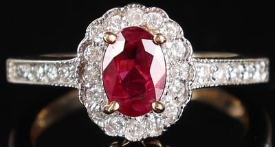 14K YELLOW GOLD LADIES RING W/ RUBY & DIAMONDS. 14k yellow gold ladies ring with a 0.75ct 