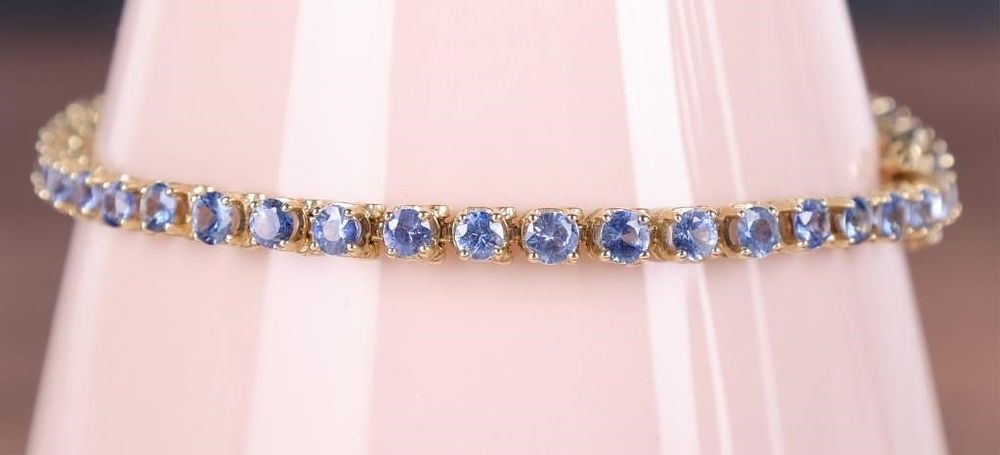 Lot 235307: 14K YELLOW GOLD SAPPHIRE LADIES TENNIS BRACELET