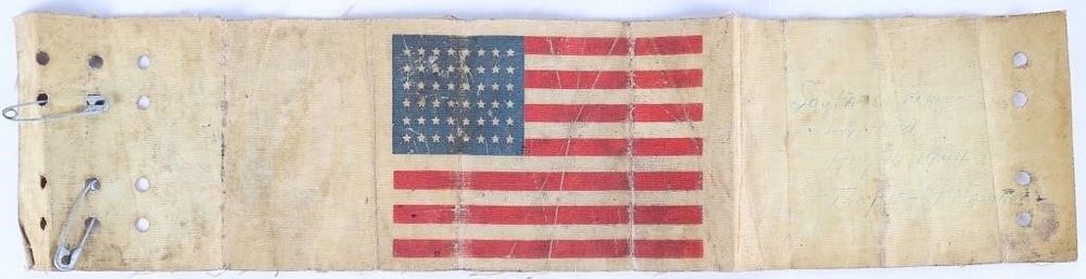 Lot 235383: SIGNED WWII US PARATROOPER FLAG OILCLOTH ARMBAND