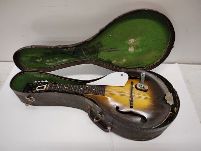 mandolin. gibson mandolin case is in rough shape Dimensions: 6 x 28 x 11 in