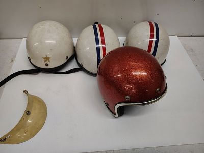 helmets. (4) 1970s helmets Dimensions: 9 x 22 x 18 in