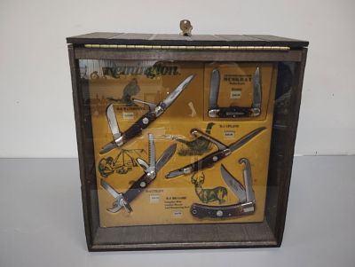 display. remington display with knives and key with knive boxes 14 tall 14 wide 9 deep 