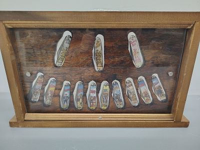 display. 13 vintage novelty knives Dimensions: 12 x 20 x 3 in