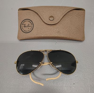 sunglasses. ray-ban gold and black aviator sunglasses and a case Dimensions: 3 x 6 x 1 in