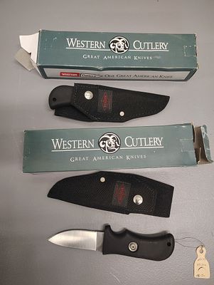 knives. 2 western cutlery sheath knife Dimensions: 4 x 12 x 4 in