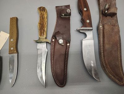Knives. 3 sheath knives and 1 fishing fillet knife Dimensions: 5 x 15 x 7 in