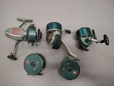 Fishing items. 5 heddon fishing reels Dimensions: 5 x 12 x 9 in