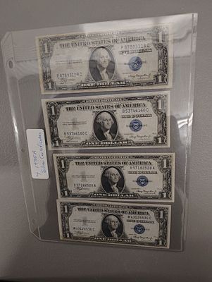 Coins. 4 1935A silver certificates Dimensions: 1 x 6 x 1 in