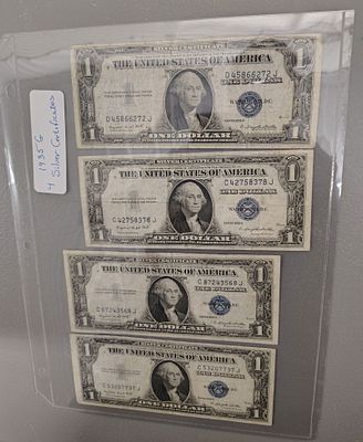 Currency. 4 1935G silver certificates Dimensions: 1 x 6 x 1 in