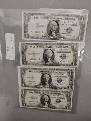 Currency. 1935 F silver certificates Dimensions: 1 x 6 x 1 in