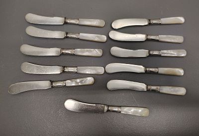 butter knives. 11 landers frary &amp; clark butter knives sterling silver band mother of pearl 