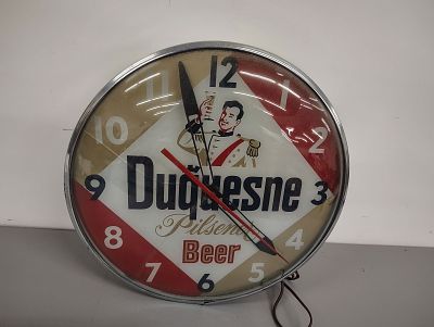 Beer clock. Duquesne Beer lights up and works face is cracked 15'' diameter Dimensions: 15 x 4 x 