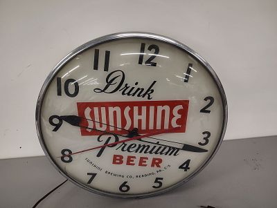 Beer clock. Sunshine Beer lights up and works Dimensions: 15 x 15 x 5 in