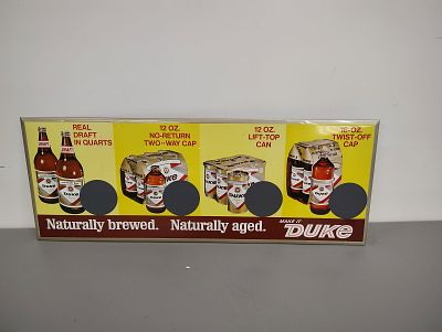 Beer sign. Duke Beer sign tin over cardboard Dimensions: 13 x 35 x 1 in