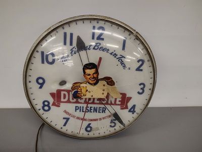 Beer clock. Duquesne Beer clock plastic face is cracked lights up but does not work Dimensions: 