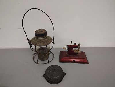 Collectibles. railroad lantern, sewing machine and 1873 door bell Dimensions: 10 x 12 x 15 in