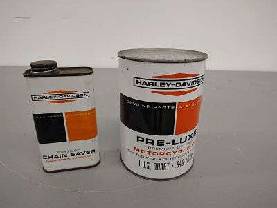 oil cans. (2) Harley Davidson cans, one oil and one chain saver - both are full Dimensions: 6 x 