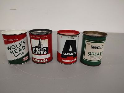 grease and lube cans. (4) 1-pound grease and lube cans Wolf's Head, Penn Drake, Alemite and 