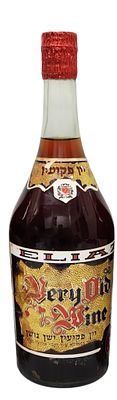 יין פקיעין ישן נושן – יקבי אליעז, בנימינה | שנות ה־70. בקבוק יין אדום מתוק מסוג פקיעין ישן נושן 