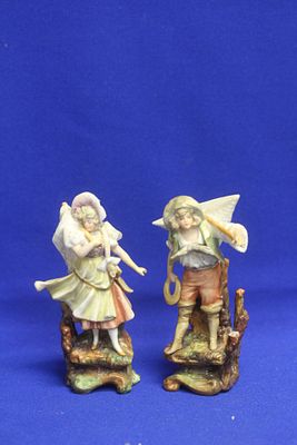 A Pair of Ceramic Figurines. please note: minor losses as shown - 5 inches tall