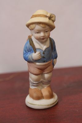 A Hummel Look-a-Like Figurine. 4 5/8" tall
