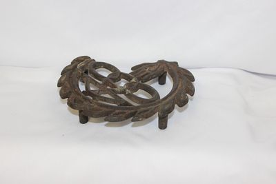 A Cast Iron Trivet. 5 1/2" in diameter