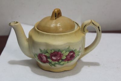 A Small Ceramic Teapot. 5 1/2" across