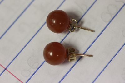 A Pair of 14 Karat Gold Earrings. as shown