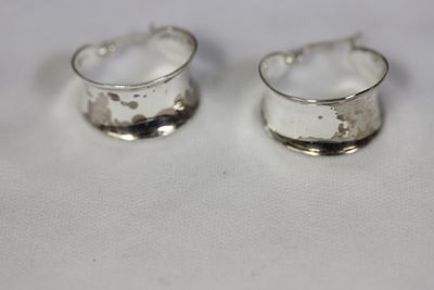 A Pair of Sterling Earrings. as shown