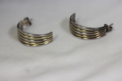 A Pair of Sterling Earrings. two tone