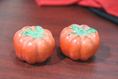 A Pair of Tomato Form Salt and Pepper sHaker. 1 3/8" tall