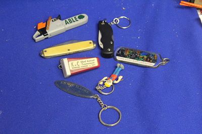 Lot of Miscellanious Items. to include vintage lighter, knives and key chains