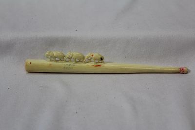 A Carved Bone Elephant Cigarette Holder. 5 3/8" long