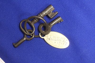An Antique Jail Cell Key with Tag - 1912. longest key - 2 1/8" long - rare find
