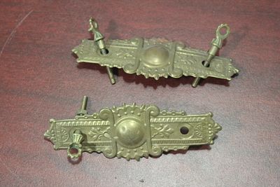 Set of Two Drawer Pulls. please note: one screw is missing