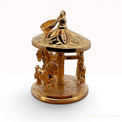 14K Yellow Gold Carousel Pendant. In good condition and weighs 11.7 grams. The horses do move. 