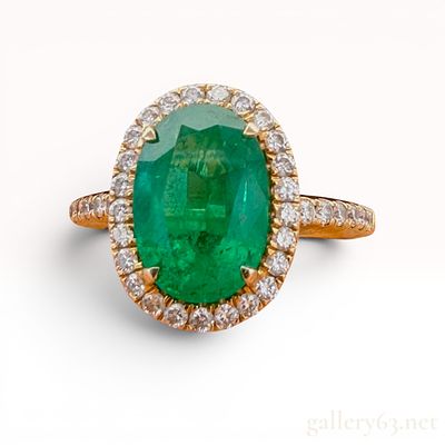 14K Yellow Gold Emerald and Diamond Ring. The emerald is approximately 2.60 carats with 0.65 