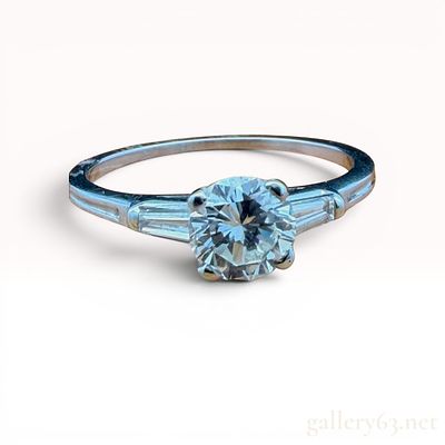 Tiffany Platinum Diamond Ring. Features a 0.65 carat center stone. Size 6 and weighs 2.3 grams. 