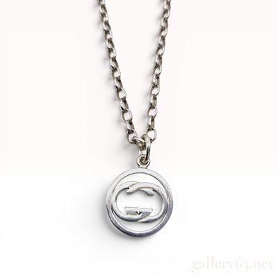 Gucci Sterling Silver Interlocking GG Logo Pendant Necklace. This is a sterling silver pendant 