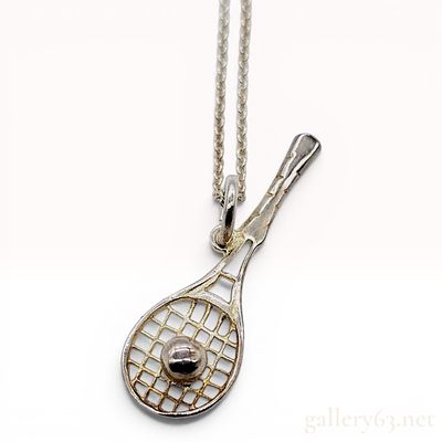 Tiffany and Co. Sterling Silver Tennis Racket and Ball Necklace. A sterling silver necklace 