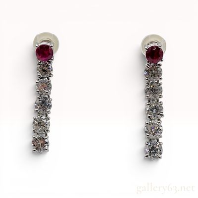 A Pair of Platinum and 1.60ctw Diamond Drop Earrings. A pair of platinum drop earrings, each 