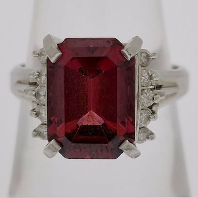 Platinum Emerald-Cut Red Garnet and Diamond Cocktail Ring. A platinum cocktail ring featuring a 