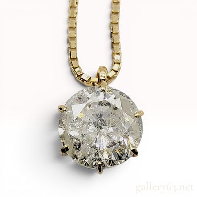 1.25 Carat Round Brilliant Cut Diamond Solitaire Pendant Necklace in 18K Yellow Gold. A diamond 