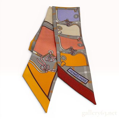 Hermes Couvertures et Tenues de Jour Silk Twilly Scarf. This Hermes Twilly scarf is crafted from 