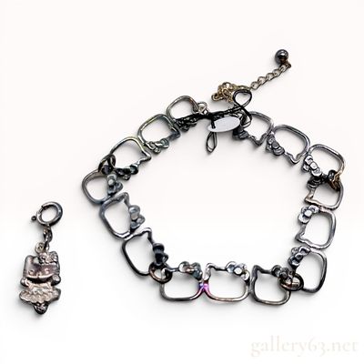 Sanrio Sterling Silver Hello Kitty Link Bracelet and Figural Charm Set. This two piece jewelry 