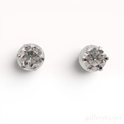 A Pair of Platinum and Round Brilliant Cut Diamond Solitaire Stud Earrings (.35ct/each). A pair 